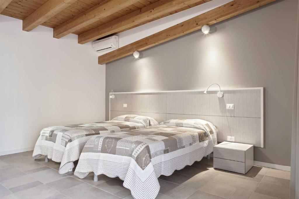 Postel nebo postele na pokoji v ubytování B&B Agorà