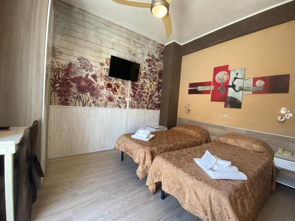 Postel nebo postele na pokoji v ubytování Hotel Eva La Romantica