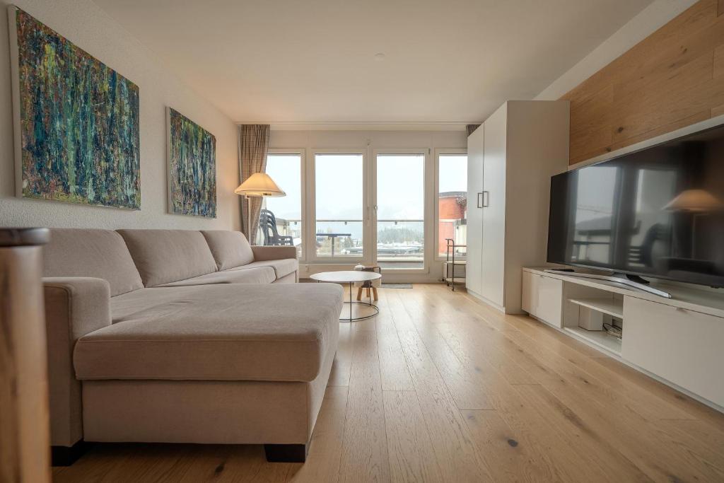 TV a/nebo společenská místnost v ubytování Galerie Obersee 4C