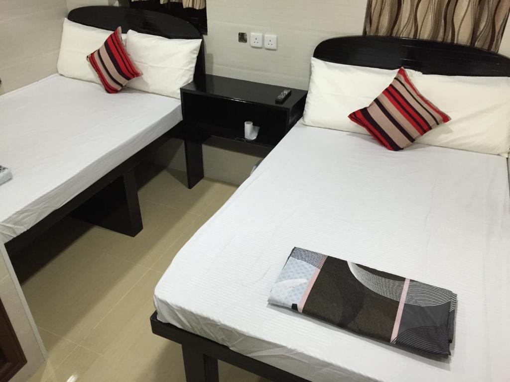 Una cama o camas en una habitación de Primo Guesthouse