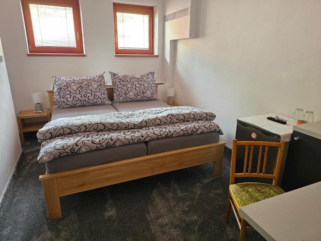 Postel nebo postele na pokoji v ubytování hotel KORUNA