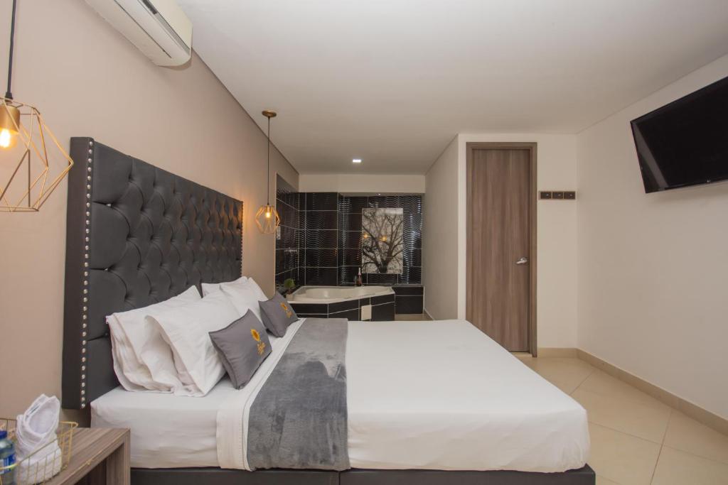 Postel nebo postele na pokoji v ubytování Hotel Perlatto