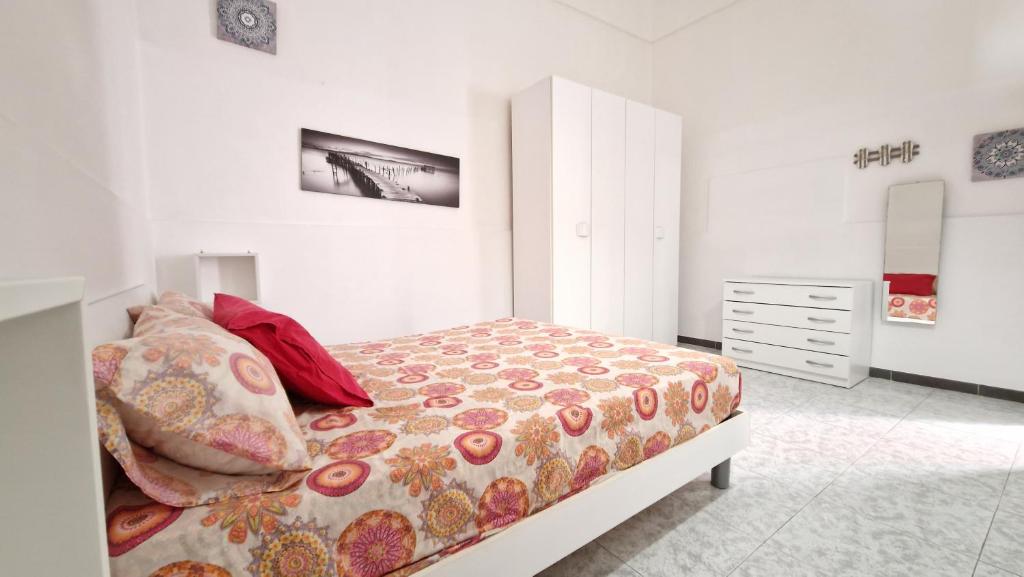 a bedroom with a bed and a dresser at Economy Guest House in Gallipoli