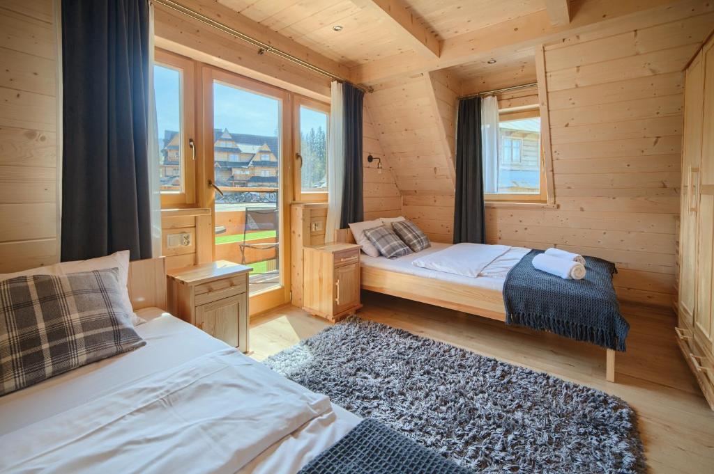 Posteľ alebo postele v izbe v ubytovaní Domek Góralski Premium - Highlander Chalet Kościelisko-Zakopane