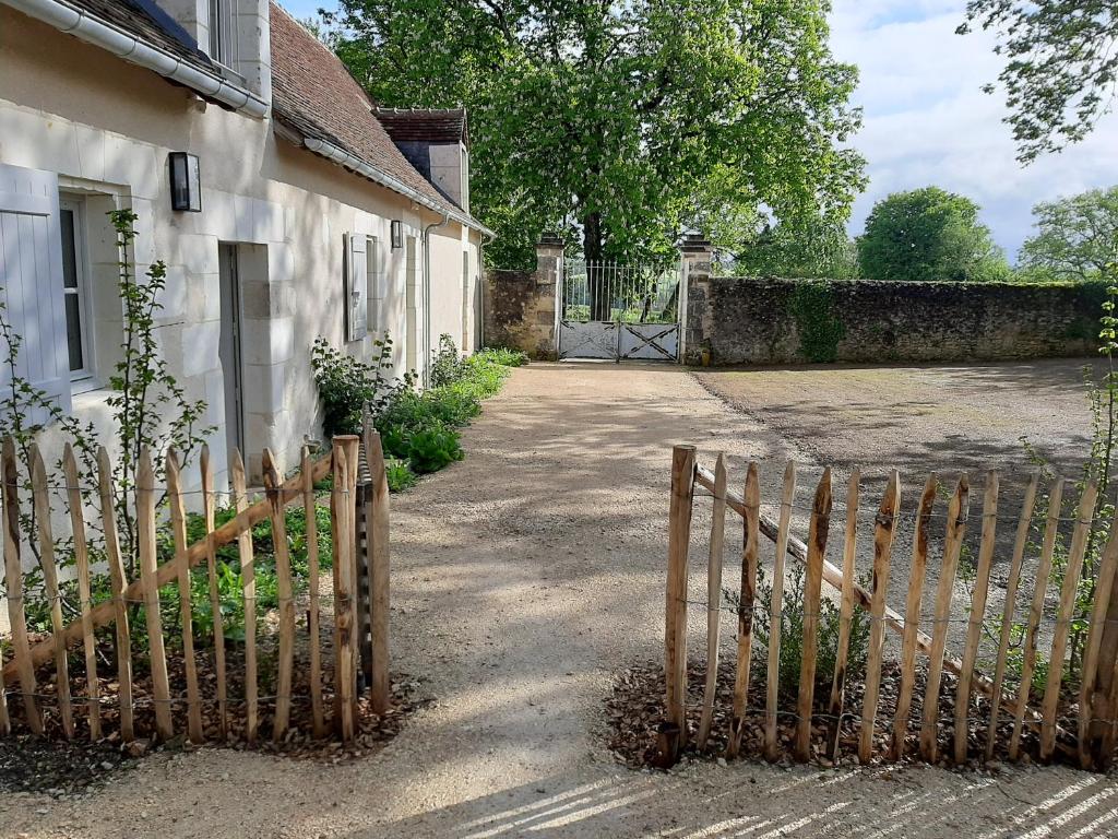 a wooden fence in front of a house at Le puits renaissance in Chambourg-sur-Indre