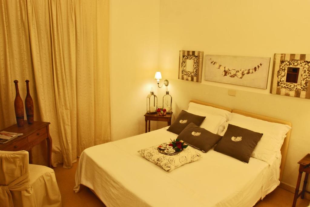 Postel nebo postele na pokoji v ubytování Hotel Lido Garda