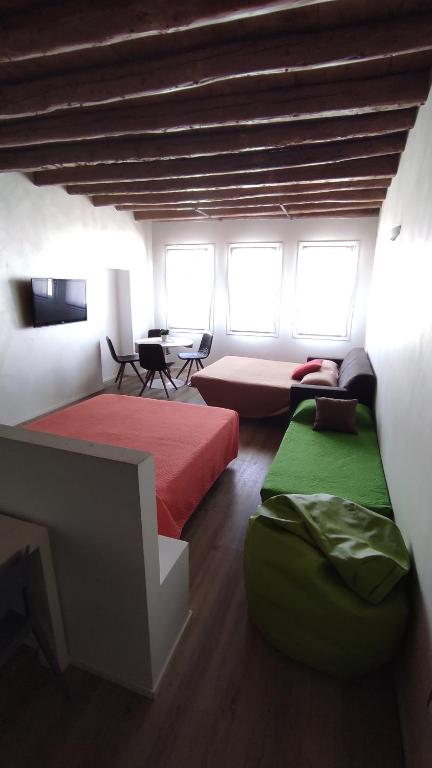 A bed or beds in a room at Ca' dell'Angelo