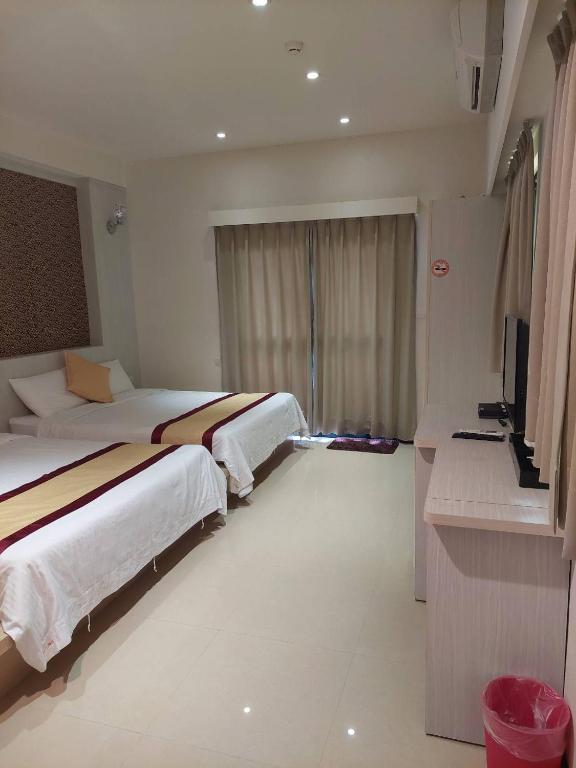 Postel nebo postele na pokoji v ubytování Penghu Luna Sea Homestay