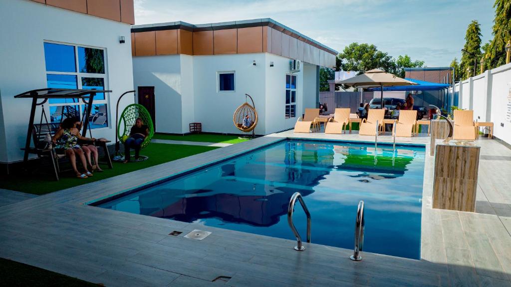 a swimming pool on the side of a building at Mboka Village in Kahama