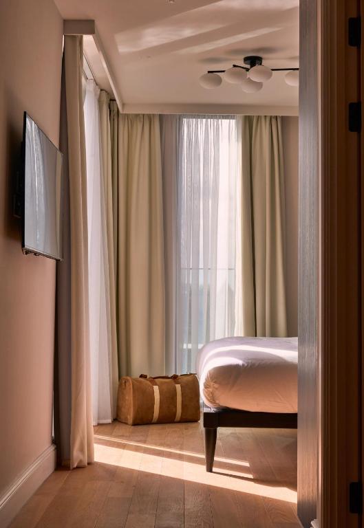 a bedroom with a bed and a window at The Store in Oxford