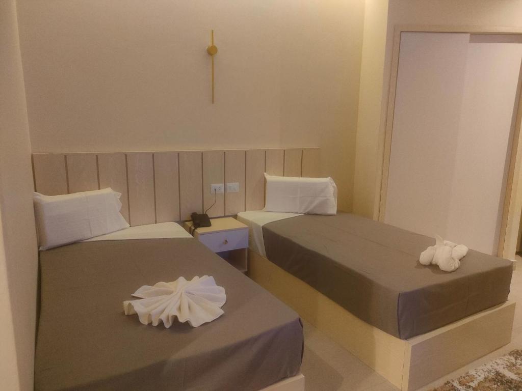 Postel nebo postele na pokoji v ubytování City View Palace hotel