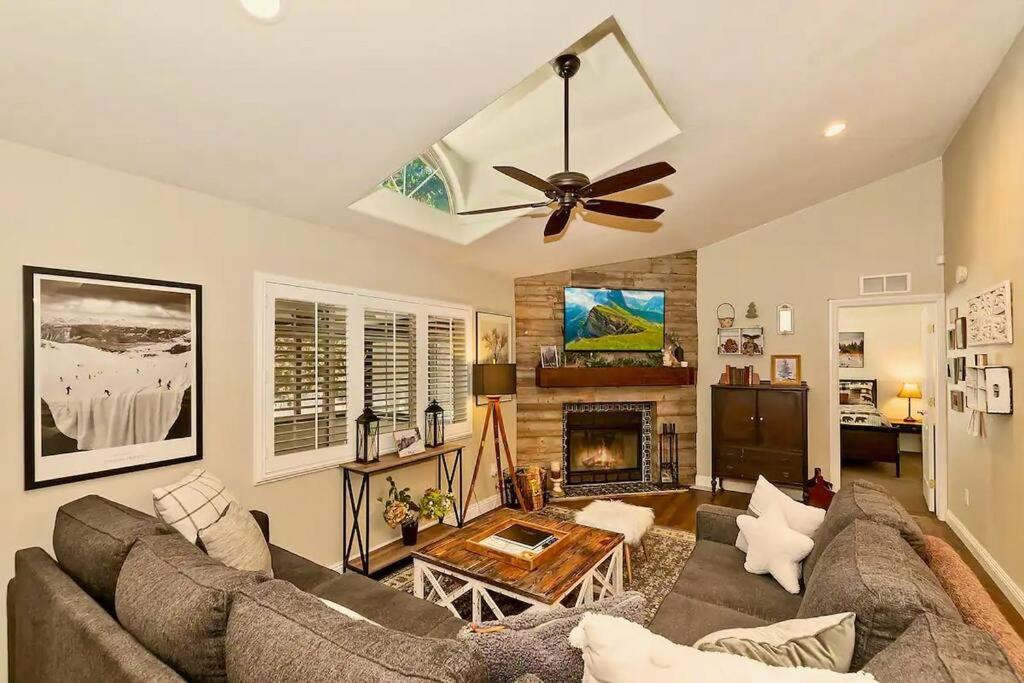 a living room with a couch and a ceiling fan at Fitzy's Fir Lodge - Fun For the Whole Family, Dogs Welcome, Jacuzzi Tub in Sugarloaf