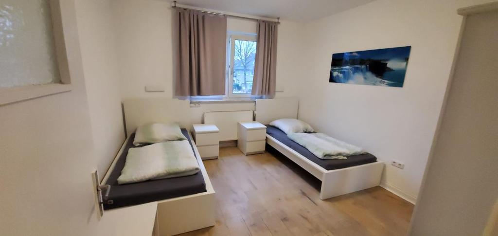 Un ou plusieurs lits dans un hébergement de l'établissement Holiday Home Cologne