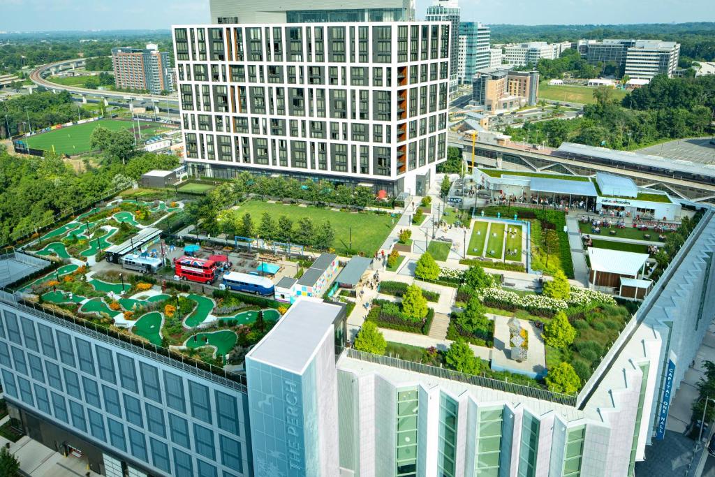 an aerial view of a large building with a park at The Watermark Hotel in Tysons Corner