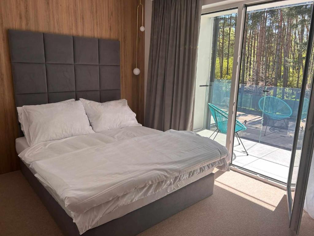 Posteľ alebo postele v izbe v ubytovaní Resort EDEN domki, apartamenty i pokoje