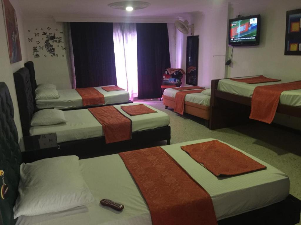Postel nebo postele na pokoji v ubytování HOTEL EJE DEL CAFÉ