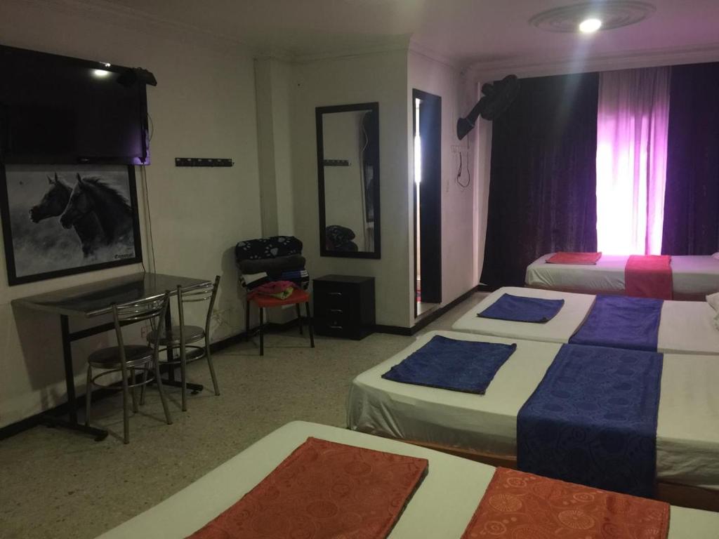 Postel nebo postele na pokoji v ubytování HOTEL EJE DEL CAFÉ