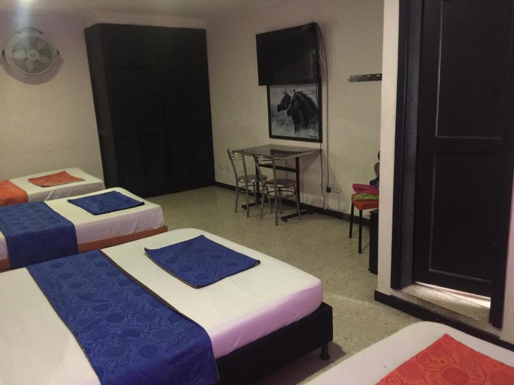 Postel nebo postele na pokoji v ubytování HOTEL EJE DEL CAFÉ