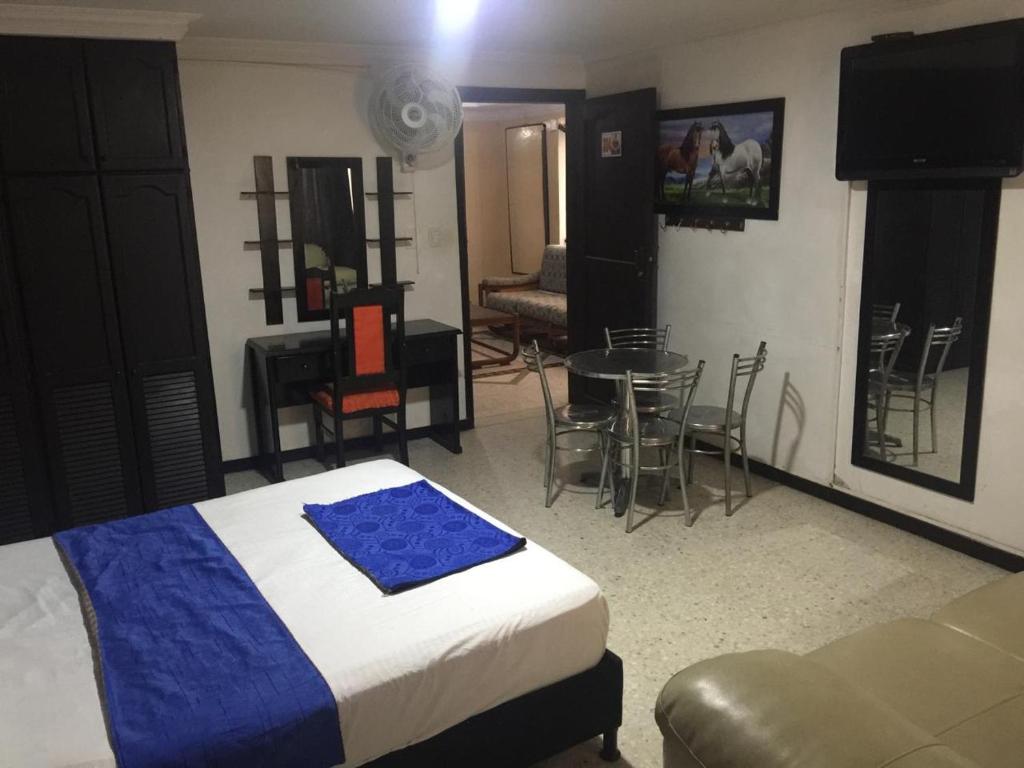 Postel nebo postele na pokoji v ubytování HOTEL EJE DEL CAFÉ
