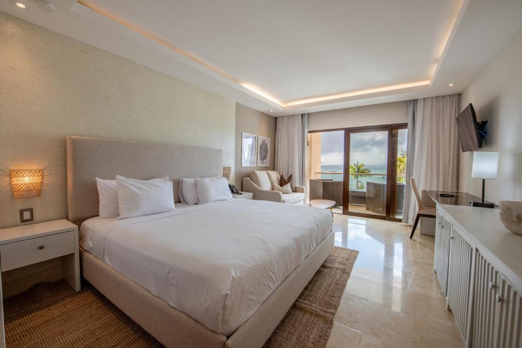 Postel nebo postele na pokoji v ubytování Hacienda Samana Bay Hotel