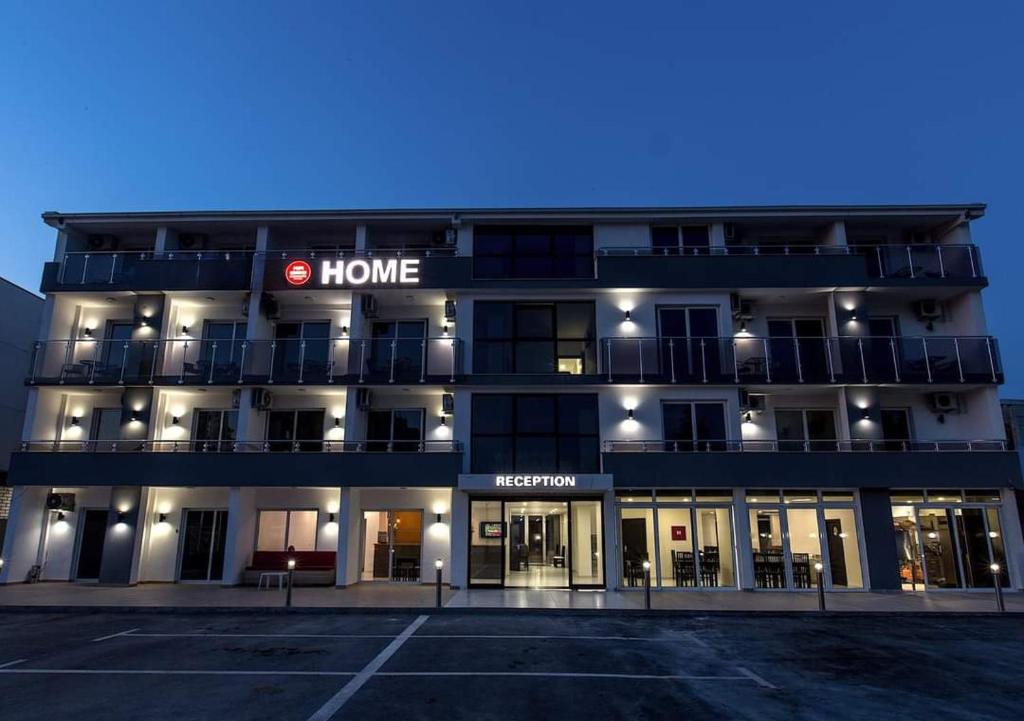 a building with a home sign on the front of it at HOME HOTEL SCANDINAVIA in Ulcinj
