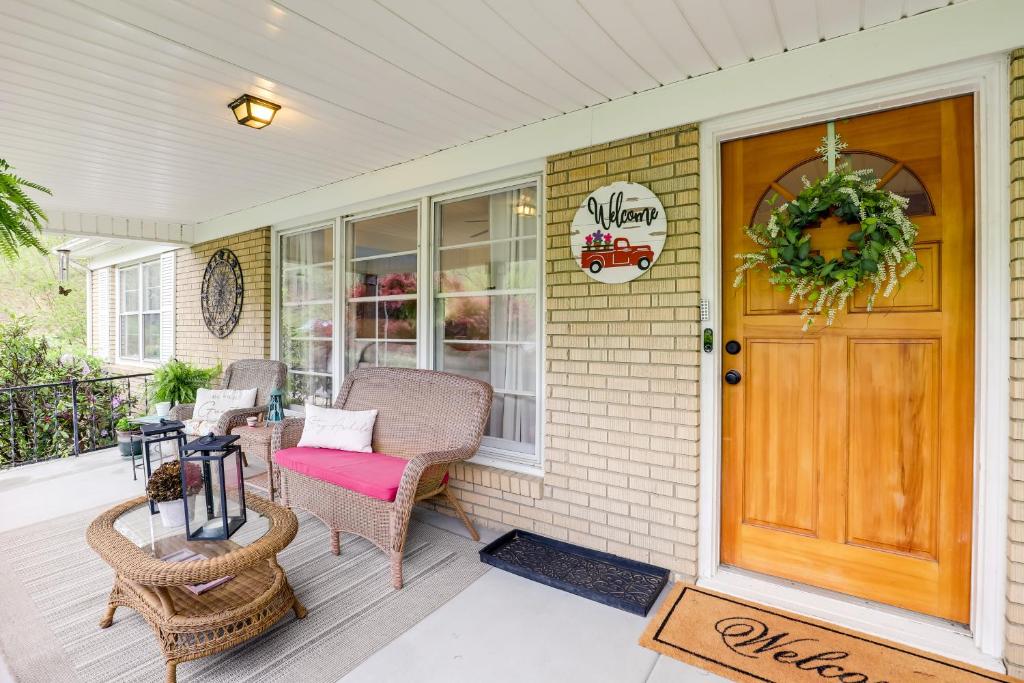 a front porch with a wreath on the door at Updated Marshall Home with Fire Pit and Game Room! in Marshall