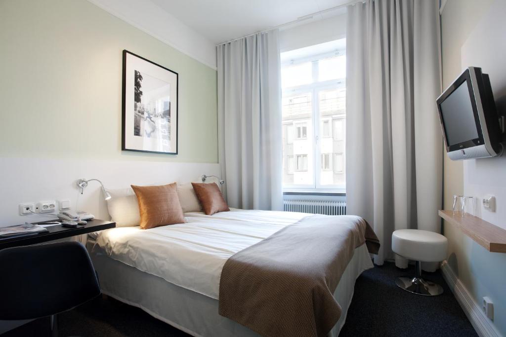 Postel nebo postele na pokoji v ubytování Hotel Örebro