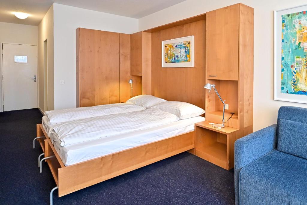 Postel nebo postele na pokoji v ubytování Hotel Zofingen