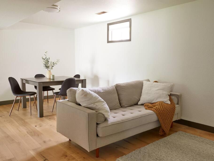 a living room with a couch and a table at New and cozy, 2 Bedroom unit in Missoula in Missoula