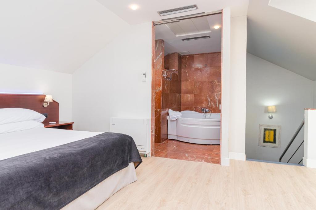 Posteľ alebo postele v izbe v ubytovaní Hotel Milagros Golf