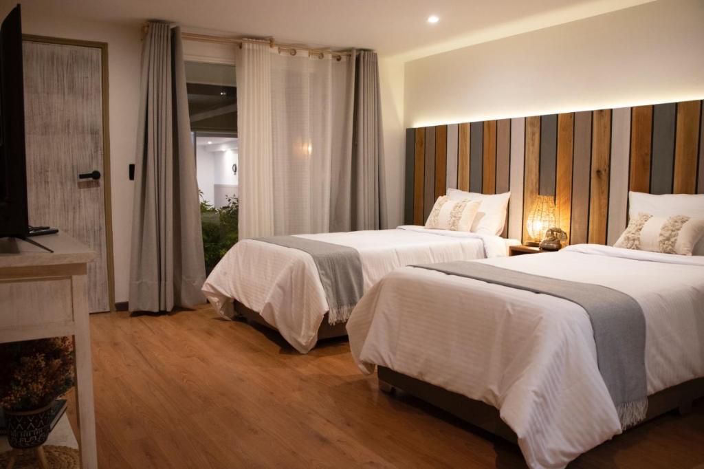 Postel nebo postele na pokoji v ubytování Marbore hotel & Spa
