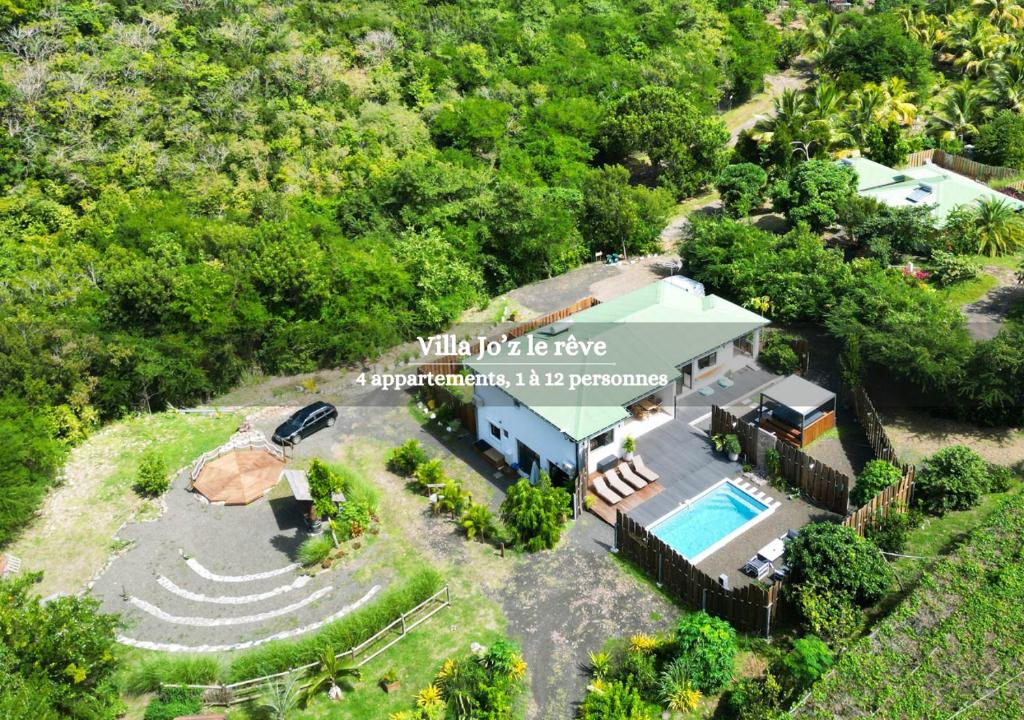 an aerial view of a house with a swimming pool at Jo'z le rêve in Les Anses-dʼArlets