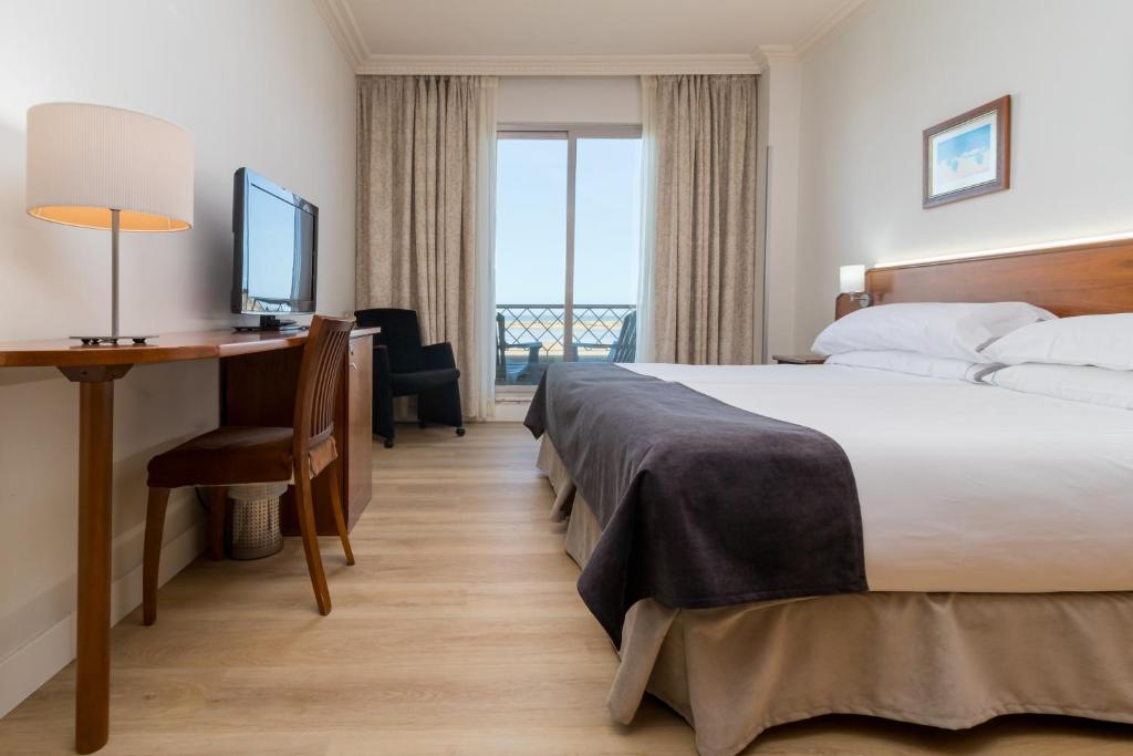 Posteľ alebo postele v izbe v ubytovaní Hotel Milagros Golf