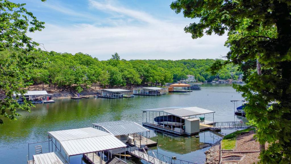a group of boats docked on a river at Barba Le Lane in Lake Ozark