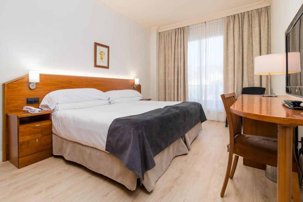 Posteľ alebo postele v izbe v ubytovaní Hotel Milagros Golf
