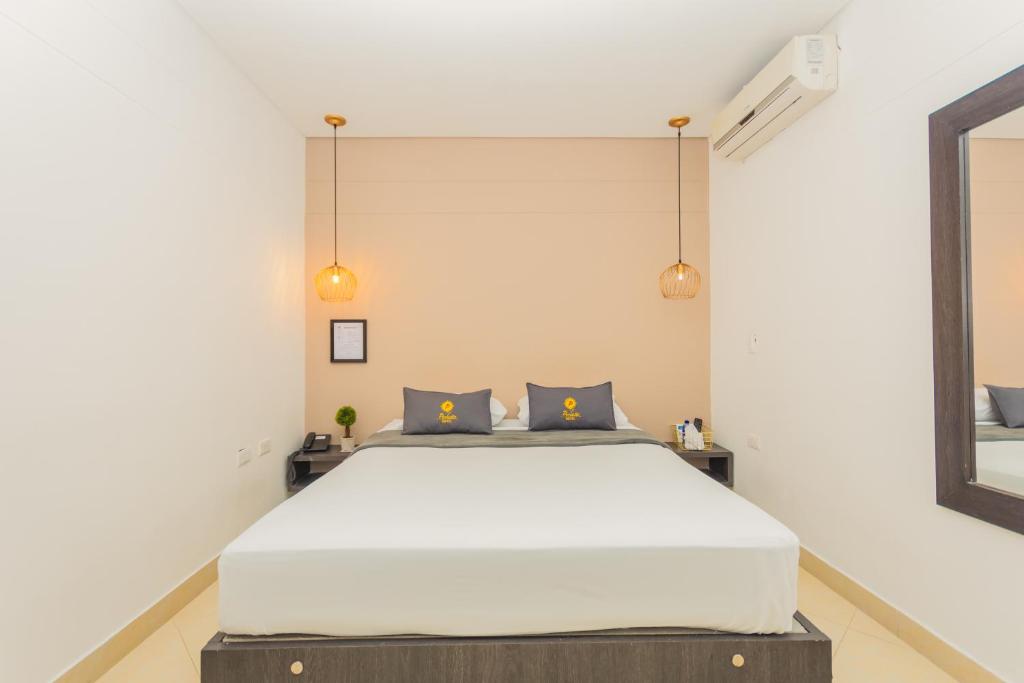 Postel nebo postele na pokoji v ubytování Hotel Perlatto