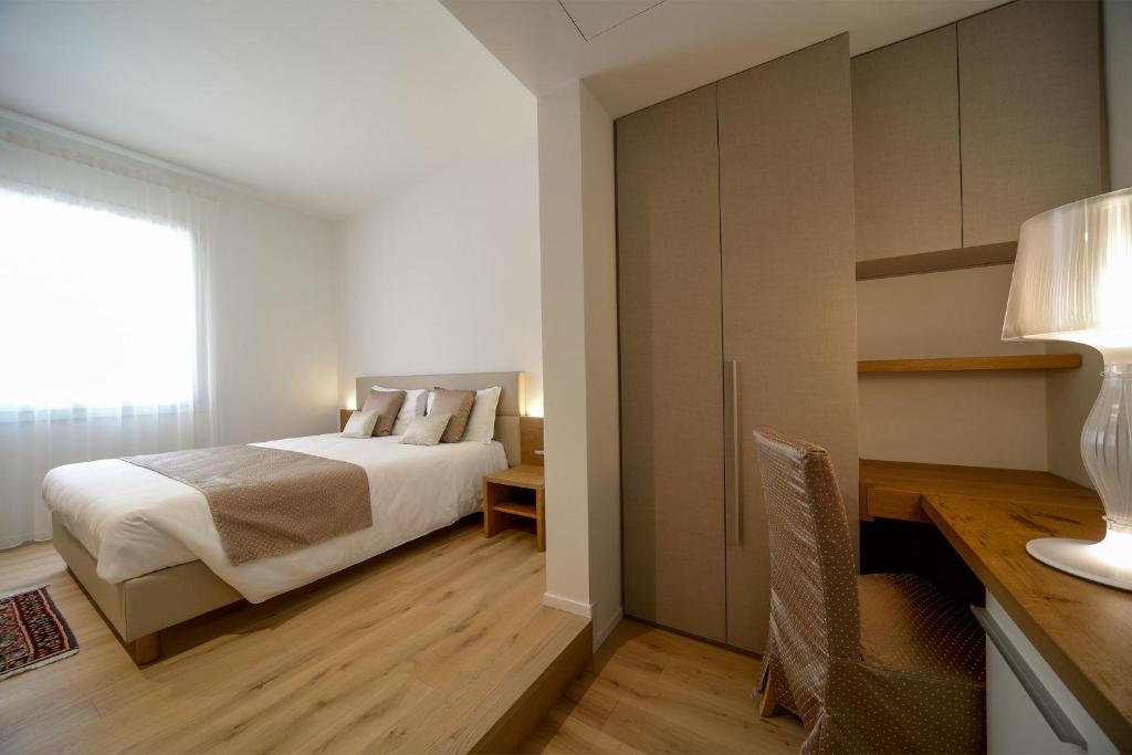 Postel nebo postele na pokoji v ubytování Hotel Ristorante Da Tullio