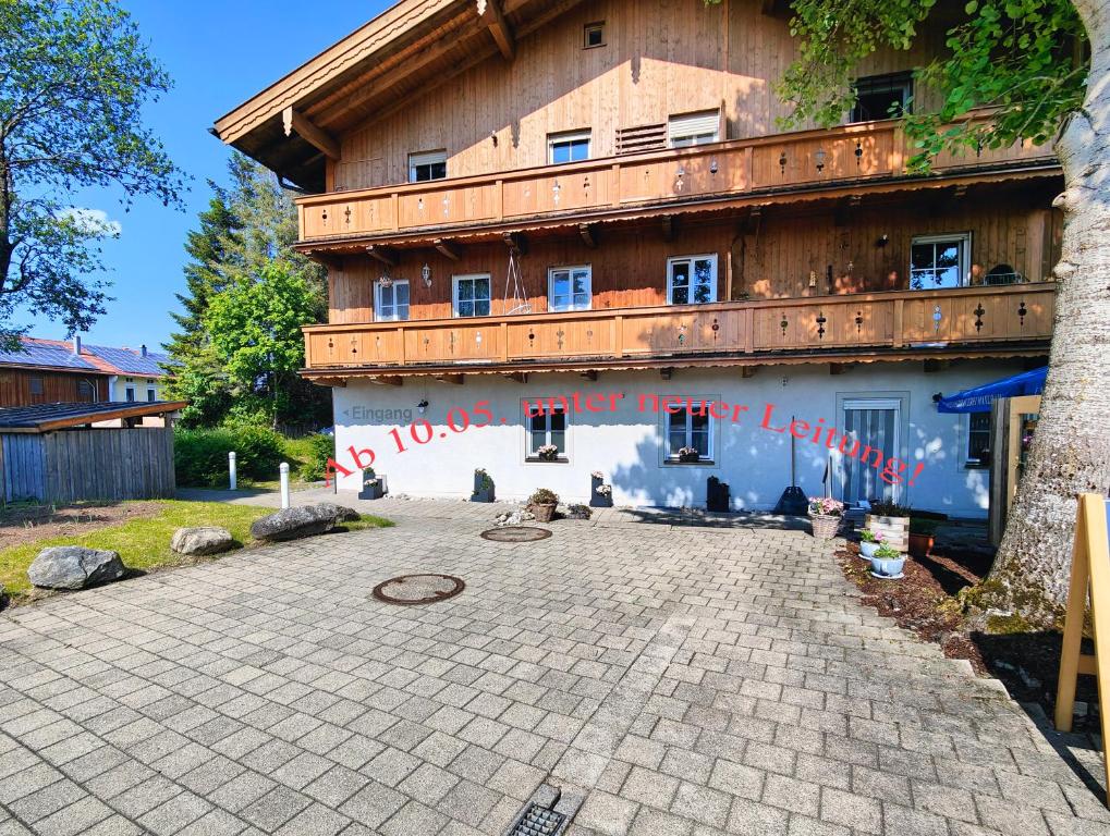 a building with writing on the side of it at A8 Hotel im Darchinger Hof, Bed & Breakfast in Weyarn