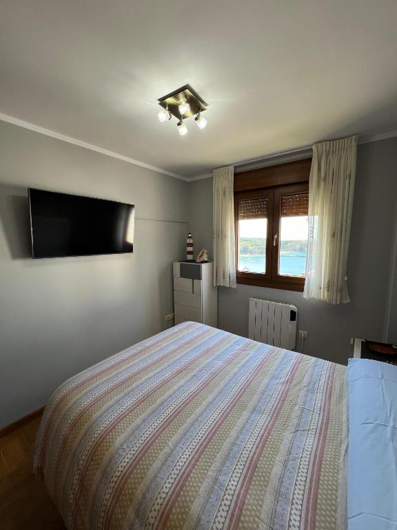 Postel nebo postele na pokoji v ubytování LUARCAPLAYA APARTAMENTO Plazas de garaje incluidas