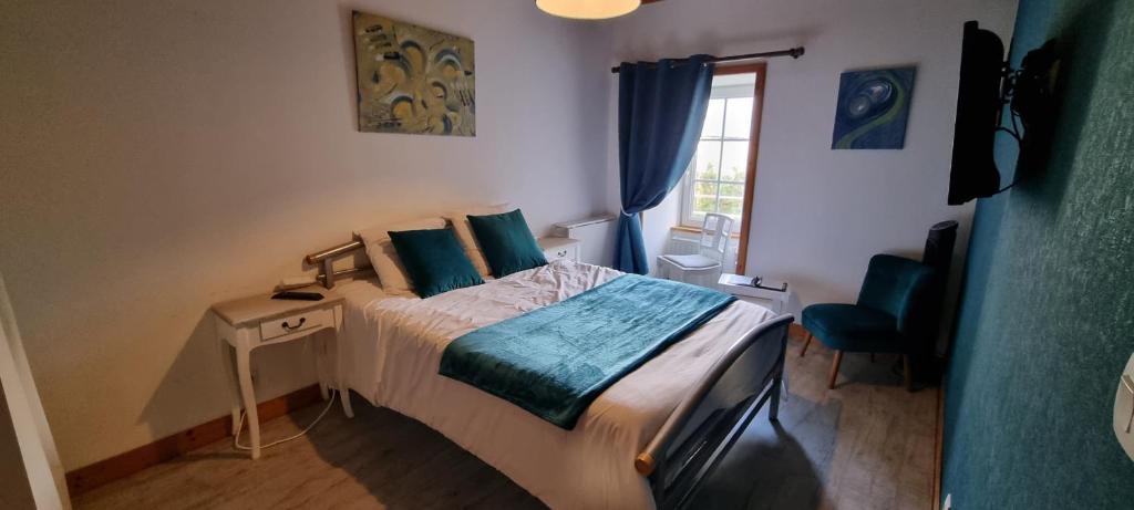 Postel nebo postele na pokoji v ubytování Le Relais de la Comté