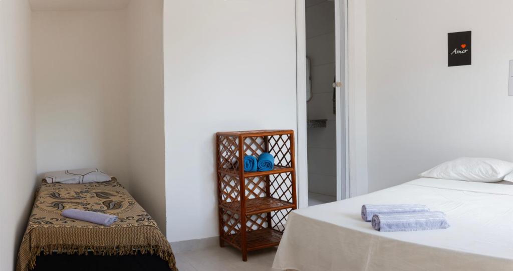 Voodi või voodid majutusasutuse CACAU HOSTEL & SUITES toas