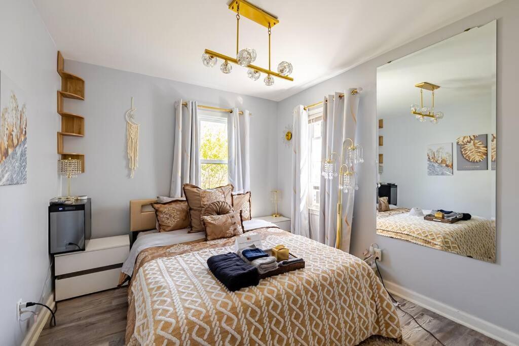 a bedroom with a large bed and a window at Elegant Serene Escape in Wyandotte in Wyandotte
