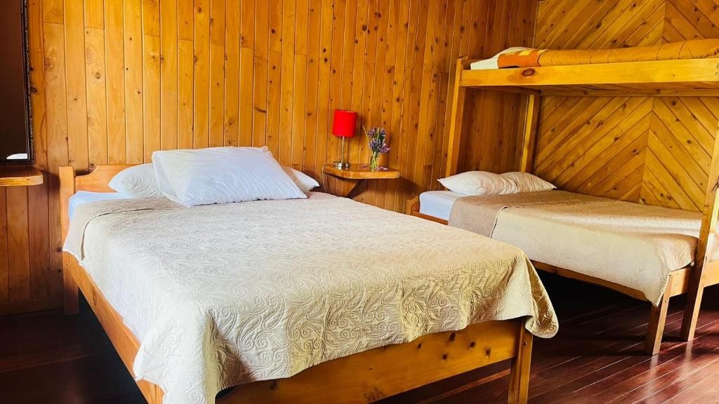 Postel nebo postele na pokoji v ubytování El Toucanet Lodge & Restaurante