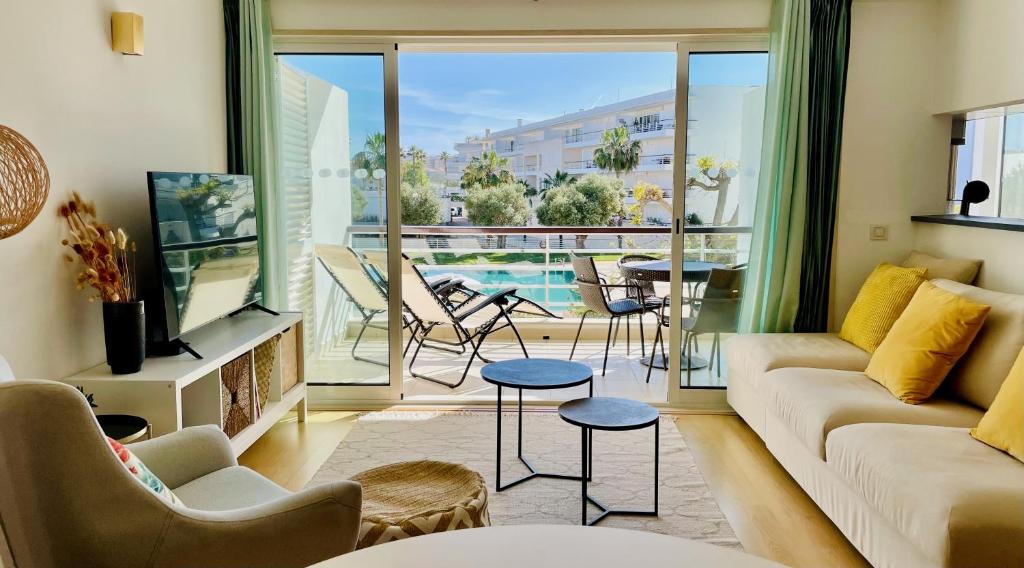a living room with a couch and a balcony at Casa Maria Vera in Lagos