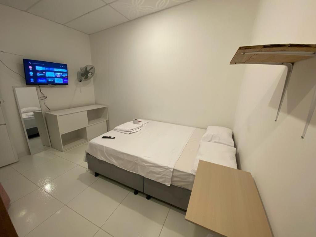 מיטה או מיטות בחדר ב-Casa Lopez Bucaramanga