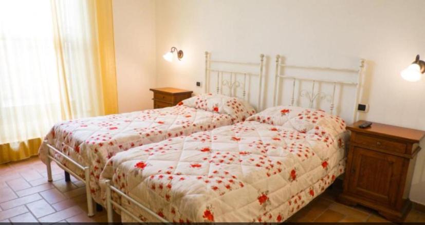 Postel nebo postele na pokoji v ubytování Affittacamere ALBA FIORITA