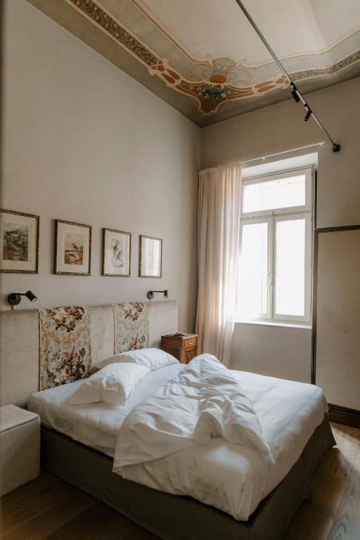 Postel nebo postele na pokoji v ubytování ALMA bed & breakfast
