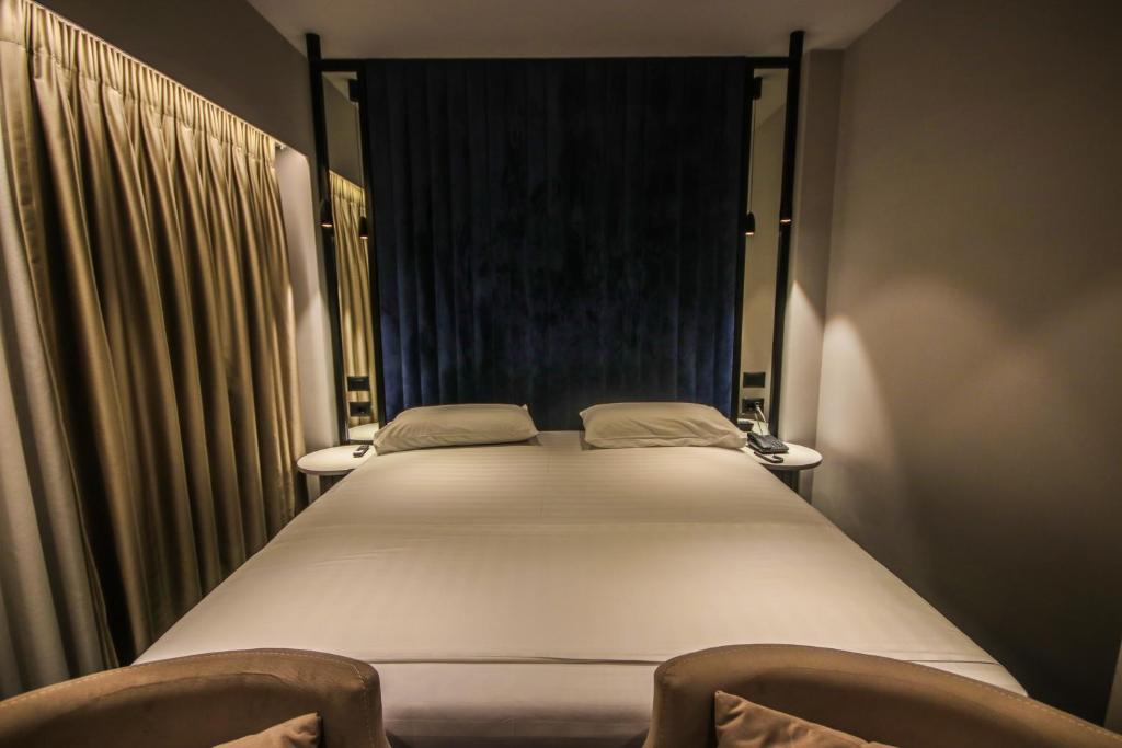 Postel nebo postele na pokoji v ubytování Atrium Hotel