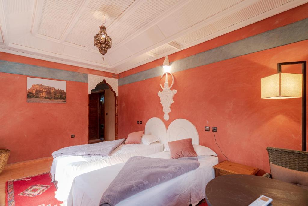 Postel nebo postele na pokoji v ubytování Riad Tourtit