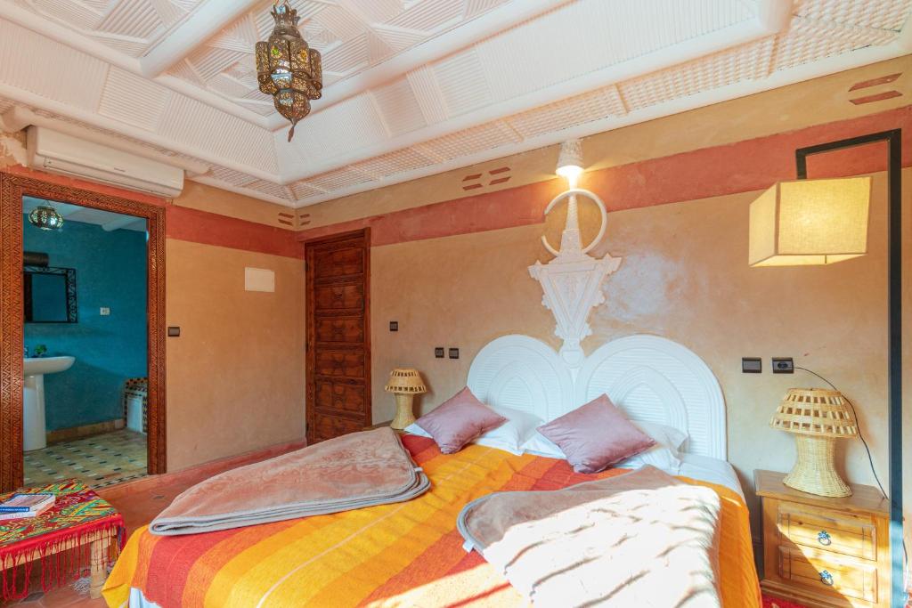 Postel nebo postele na pokoji v ubytování Riad Tourtit